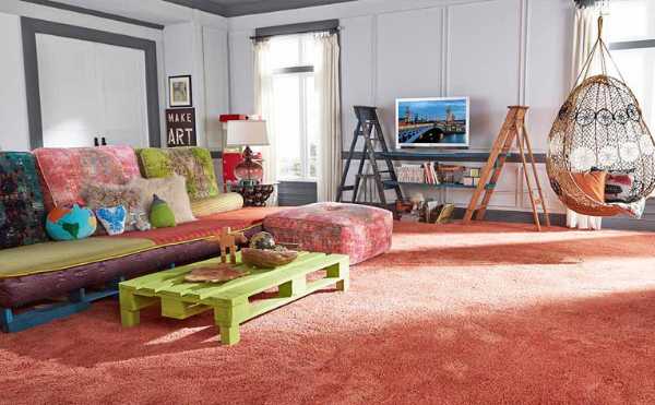 eclectic living area with bold colors and carpet